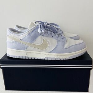 The sneakers are Nike Dunk Low Women's Shoes in the Ghost/Platinum Tint/White